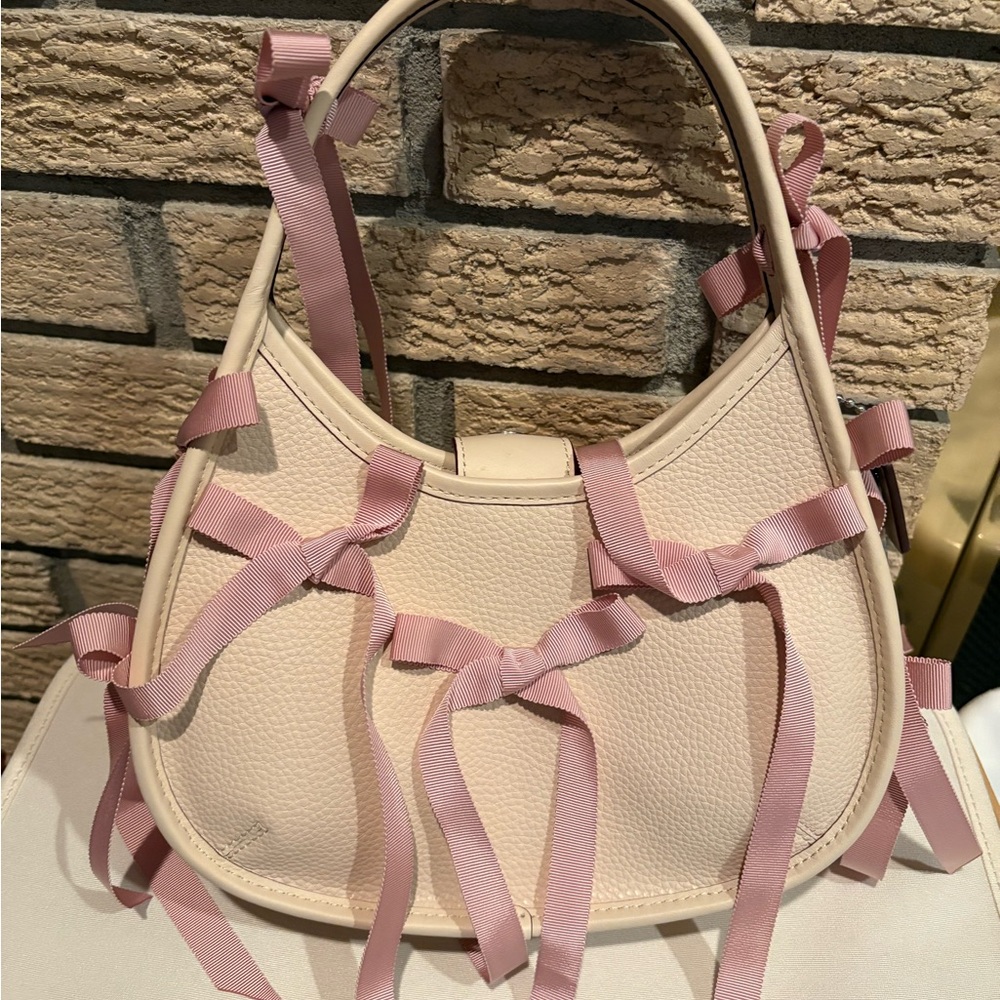 Coachtopia Ergo bag with Pink Ribbon-Accented Cream Women's Bag